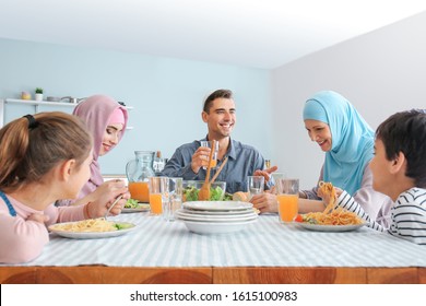 Muslim Family Having Dinner At Home