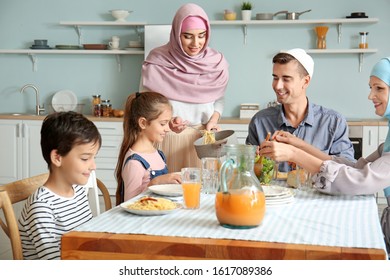 Muslim Family Having Dinner At Home