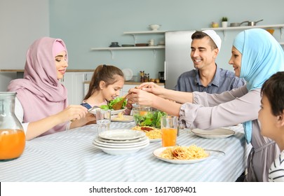 Muslim Family Having Dinner At Home