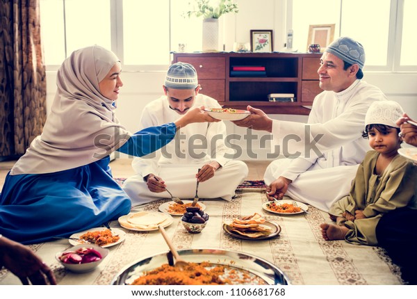 Muslim Family Having Dinner On Floor Stock Photo (Edit Now) 1106681768