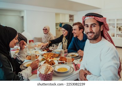  Muslim family having Iftar dinner drinking water to break feast. Eating traditional food during Ramadan feasting month at home. The Islamic Halal Eating and Drinking in modern home  - Shutterstock ID 2253082239