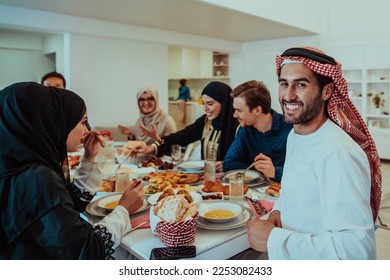  Muslim family having Iftar dinner drinking water to break feast. Eating traditional food during Ramadan feasting month at home. The Islamic Halal Eating and Drinking in modern home  - Shutterstock ID 2253082433