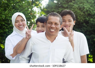 Muslim Family Having Outdoor Fun