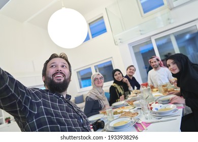 Muslim Family Taking Selfie While Having Iftar Together During Ramadan