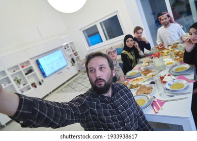 Muslim Family Taking Selfie While Having Iftar Together During Ramadan