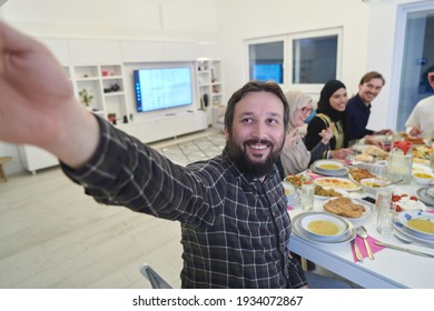 Muslim Family Taking Selfie While Having Iftar Together During Ramadan