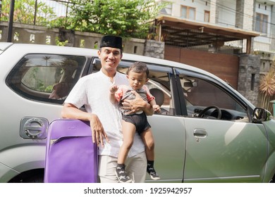 Muslim Family Travel By Car During Eid Mubarak Celebration. Asian People Going Back To Their Hometown. Father And Son On A Car Trip