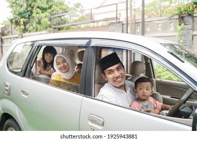 Muslim Family Travel By Car During Eid Mubarak Celebration. Asian People Going Back To Their Hometown