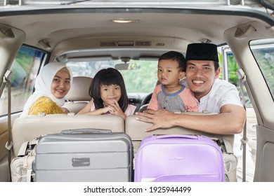 Muslim Family Travel By Car During Eid Mubarak Celebration. Asian People Going Back To Their Hometown