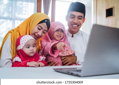 Muslim Family Video Confrence With Other Using Laptop On Eid Mubarak Celebration