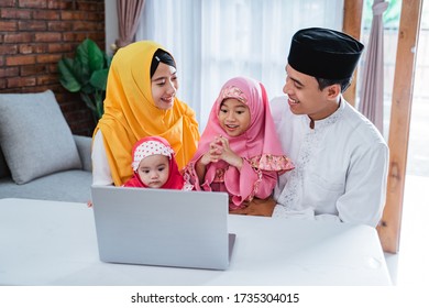 Muslim Family Video Confrence With Other Using Laptop On Eid Mubarak Celebration