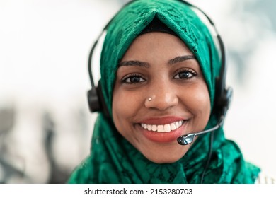  Muslim Female With Green Hijab Scarf Customer Representative Business Woman With Phone Headset Helping And Supporting Online With Customer In Modern Call Centre