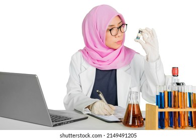 Muslim Female Scientist Checking A Test Tube And Writing On The Clipboard While Working In The Studio. Isolated On White Background