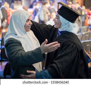 Muslim Female Student On Graduation Ceremony With Proud Mom