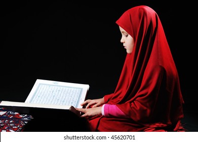 Muslim Girl On Black Background Reading Koran