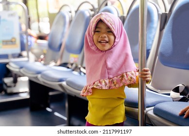 Muslim Little Girl With Hijab Riding Bus