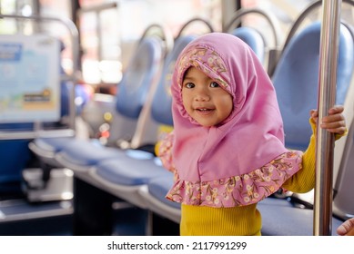 Muslim Little Girl With Hijab Riding Bus