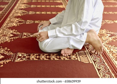 muslim praying on knees