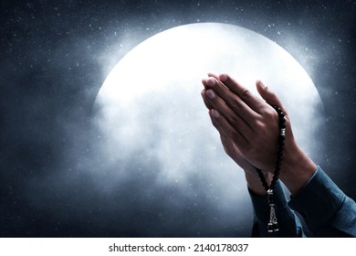 Muslim man praying on night sky moon - Shutterstock ID 2140178037