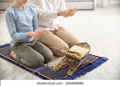 Muslim Man Praying With Son At Home