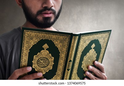 Muslim Man Reading Koran 