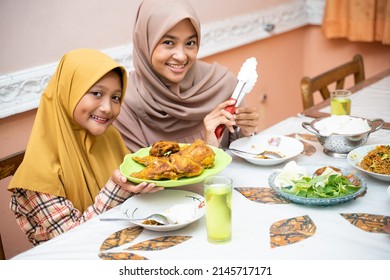 Muslim Mother Serving Some Food For Family Dinner