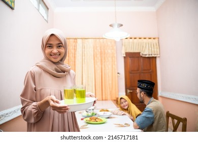 Muslim Mother Serving Some Food For Family Dinner