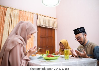 Muslim Mother Serving Some Food For Family Dinner