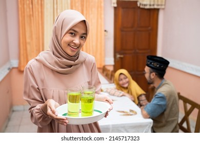 Muslim Mother Serving Some Food For Family Dinner