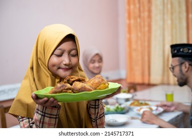 Muslim Mother Serving Some Food For Family Dinner