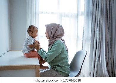 Muslim Mother And Son Having Conversation At Home