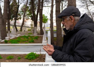 Muslim Old Man Praying In The Cemetery
