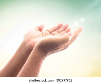 Muslim Open Two Empty Hands With Palms Up Over Blurred Makkah Background