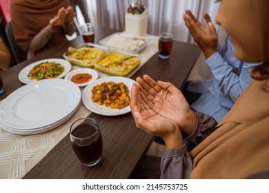 Muslim People Praying Before Break Fasting Iftar Dinner Together