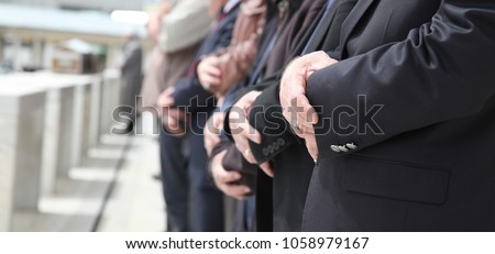 Muslim People in a Row at a Funeral in Mid Day