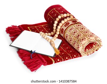 Muslim Prayer Mat, Beads And Koran On White Background