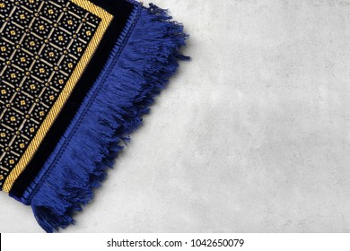 Muslim Prayer Rug On Gray Background