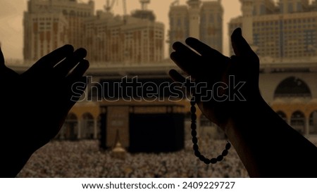 Muslim praying to Allah in front of Kaaba. Islam Iconic Mosque, Al Haram Mecca Saudi Arabia. Muslim Praying Hands in front of The Holy Kaaba which is the center of Islam inside Masjid Al Haram Mecca.