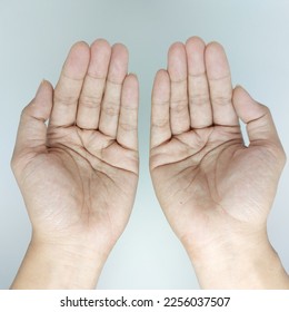 Muslim praying hands pose  top flat lay view - Shutterstock ID 2256037507
