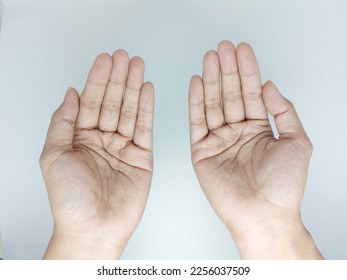 Muslim praying hands pose  top flat lay view - Shutterstock ID 2256037509