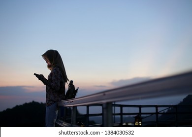 Muslim Teen Phone On Sunset Ramadan.