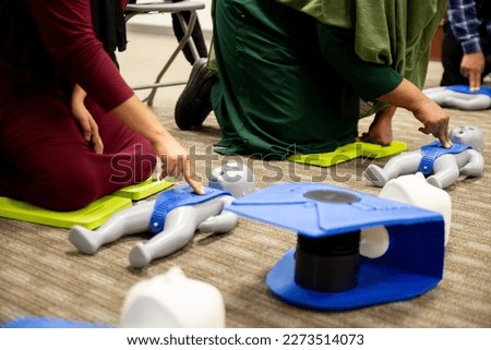 Muslim trainees taking cpr class and first aid