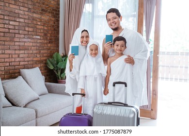 Muslim Umrah And Hajj With Family Showing Passport