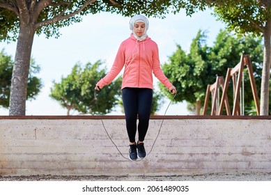 Muslim Woman Athlete Skipping Rope Outdoors