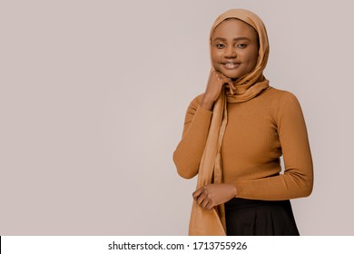 Muslim Woman Beautiful African Ethnicity Wearing Traditional Hijab, Traditional Eastern Arabic Islam Religion Clothes. Over White Studio Background. People And Religion. Confident Smart Muslim Woman