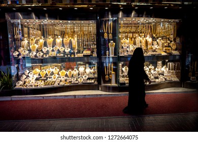 Muslim Woman In Burqa View The Windows In The Gold Souk In Dubai