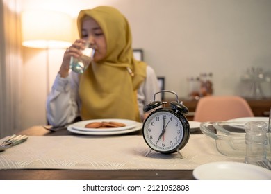 Muslim Woman Drinking A Glass Of Water On Breakfasting