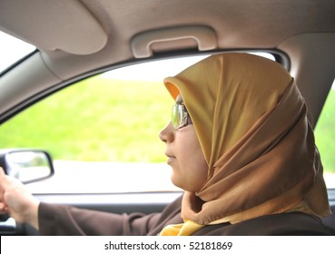 Muslim Woman Driving A Car