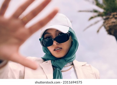 Muslim woman, fashion selfie and portrait in city, street and gen z aesthetic for beauty, blog and post. Young islamic girl, student and influencer with sunglasses, social media and travel in Dubai - Powered by Shutterstock