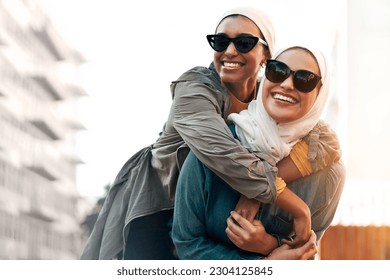 Muslim woman, friends and piggyback in city with freedom, youth and urban travel together in Qatar. Islamic women, happiness and walking in metro with funny game, sunglasses and comic journey